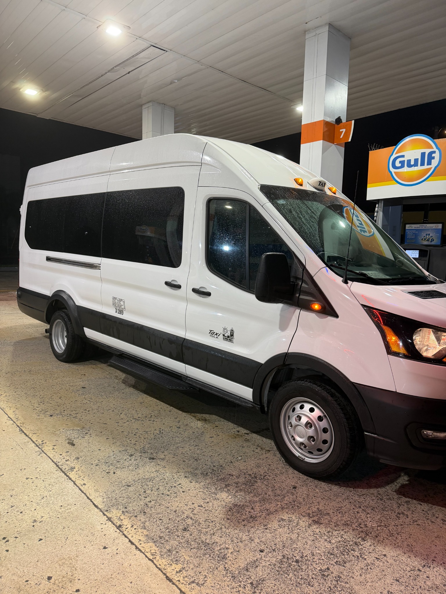 Ray’s white Ford Transit taxi van